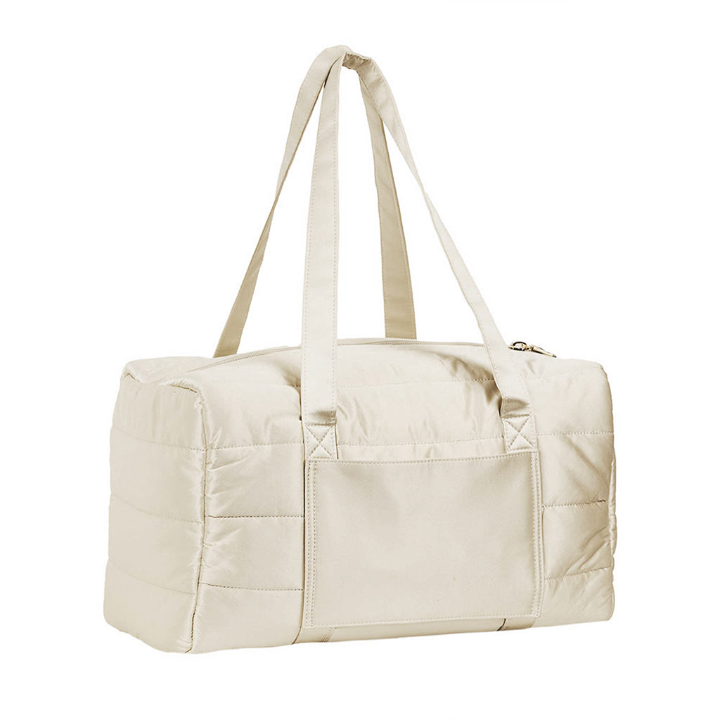 The Drowsy Silk Weekender in Dusty Gold by Drowsy is a chic rectangular bag with long handles, an exterior pocket, and a top zipper closure—ideal for stylishly carrying all your essentials on weekend getaways.