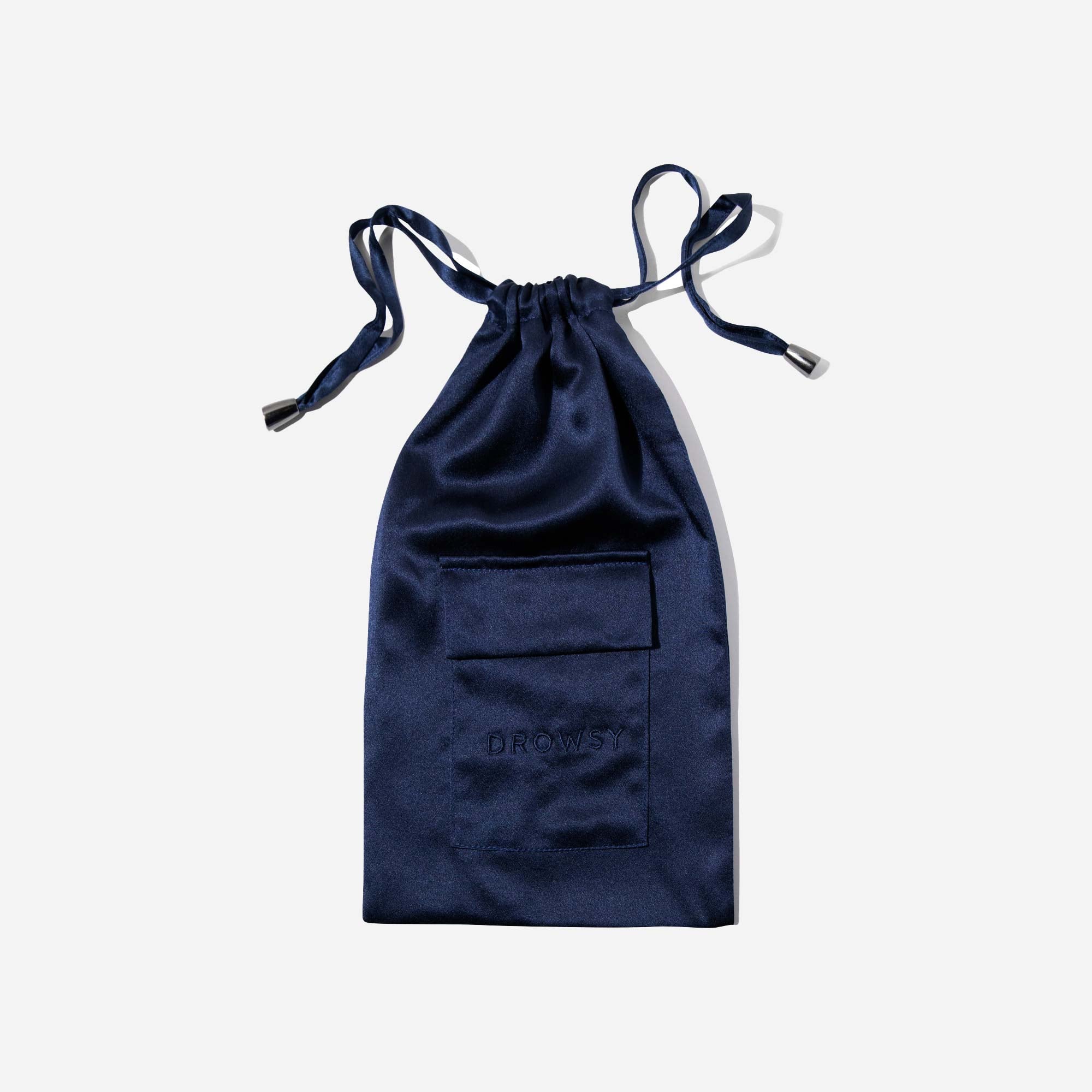 A navy blue satin drawstring pouch with a small front pocket, set against a plain white background. The word DROWSY is subtly embossed on the pocket.