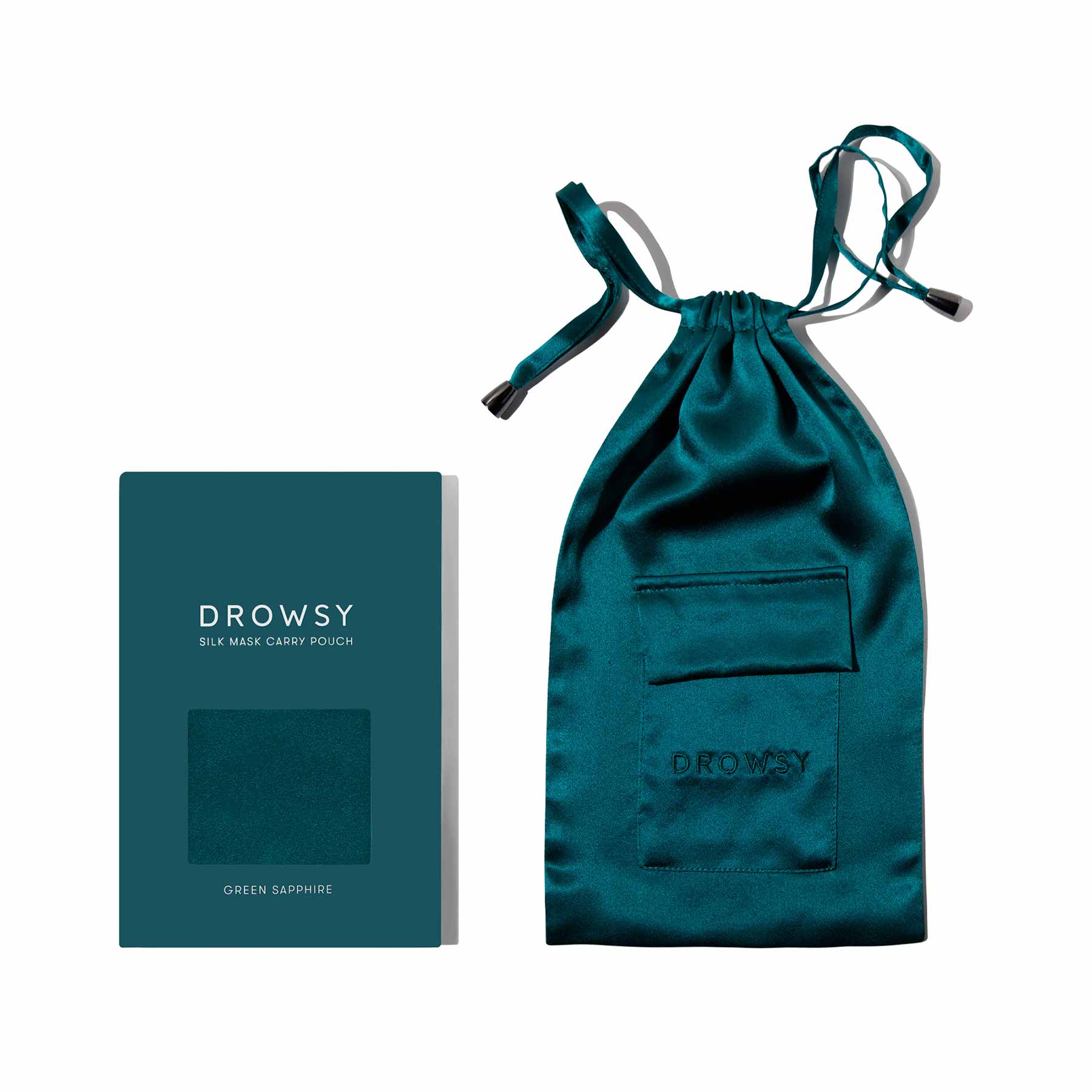 The Green Sapphire Silk Carry Pouch by drowsysleepco features teal mulberry silk, a drawstring closure, and a small front pocket. Comes in a Drowsy-branded box—perfect for storing your silk sleep mask.
