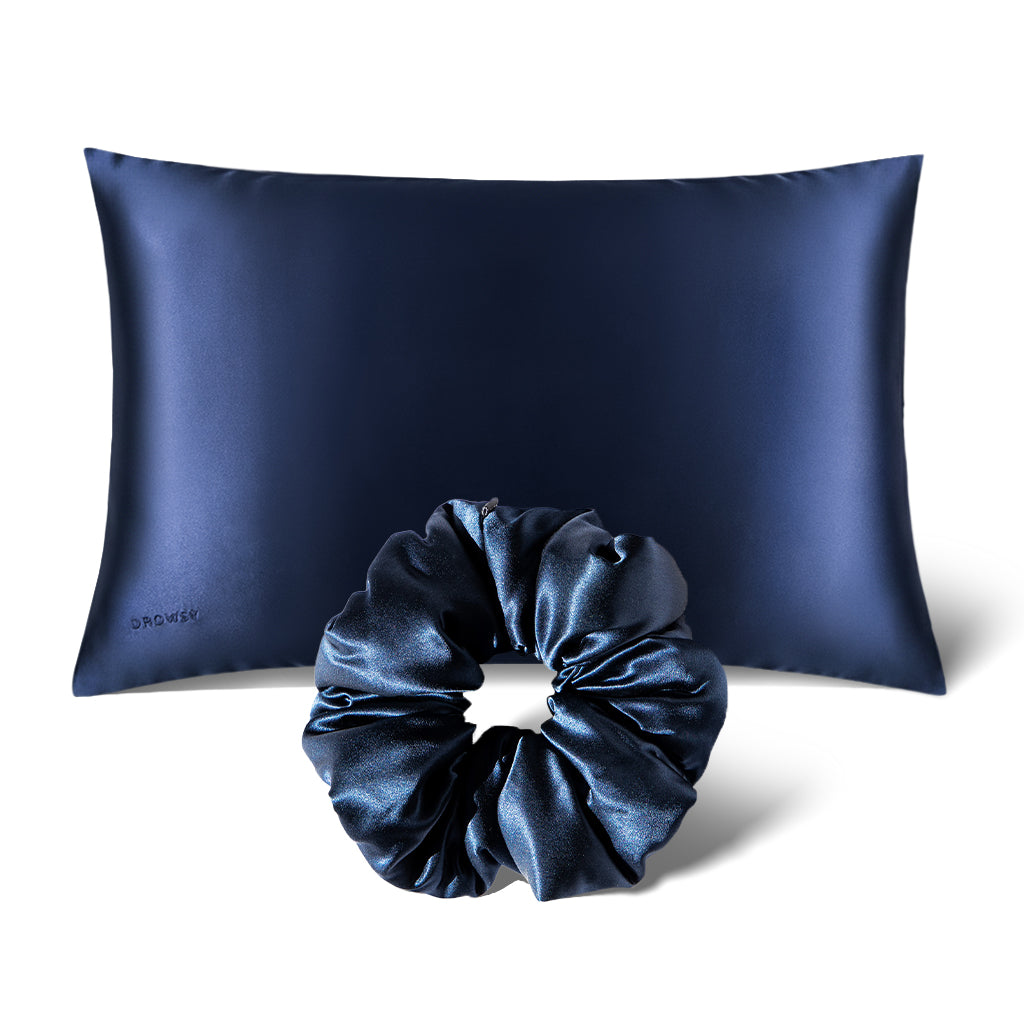 The drowsysleepco Perfect Hair Bundle Midnight Blue features a silk pillowcase and matching padded scrunchie, beautifully displayed on a plain white background.