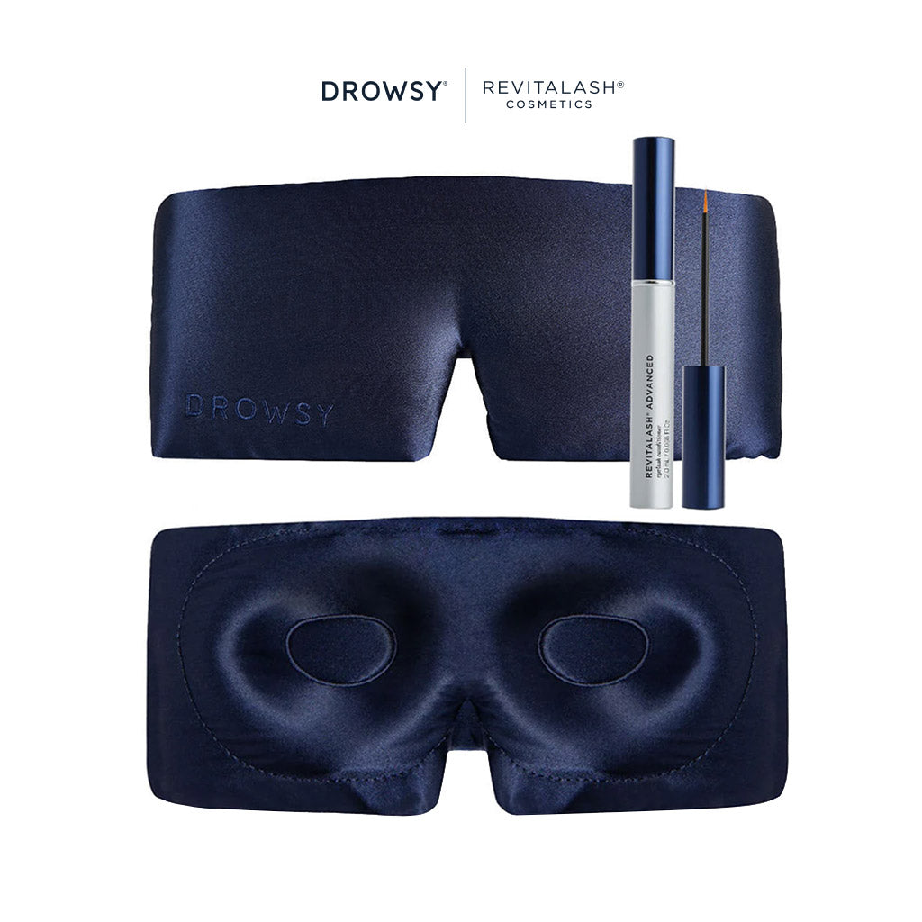 The Drowsy RevitaLash® Cosmetics x Drowsy® Dream Lashes Kit features a navy blue eyelash protecting mask shown front and back, plus a RevitaLash Advanced Eyelash Conditioner with applicator, all against a white background.