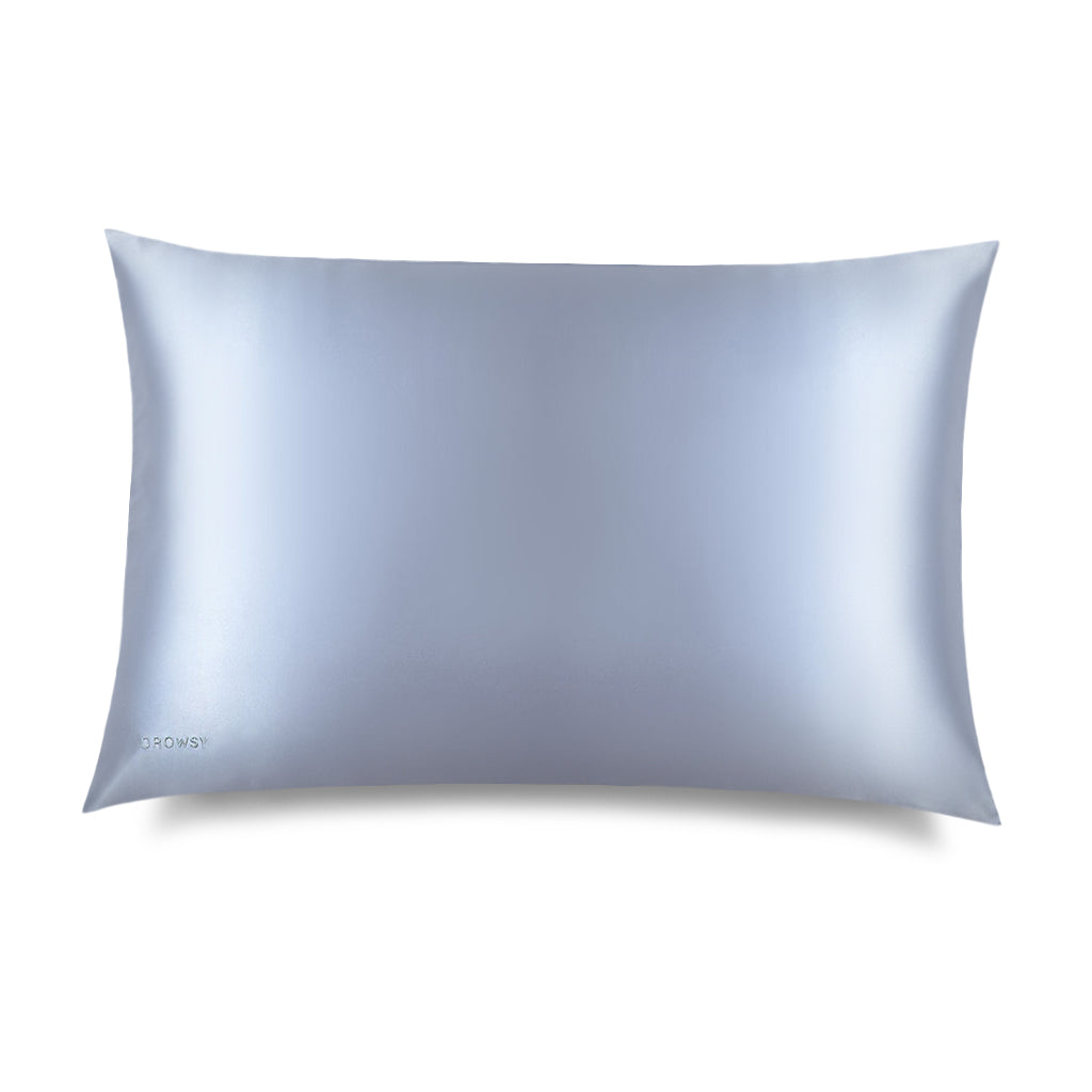 The Blue Belle Silk Pillowcase by drowsysleepco features smooth, light blue silk with a subtle sheen and "drowsysleepco" printed on the corner—an elegant hair-protecting and skincare essential, shown on a plain white background.