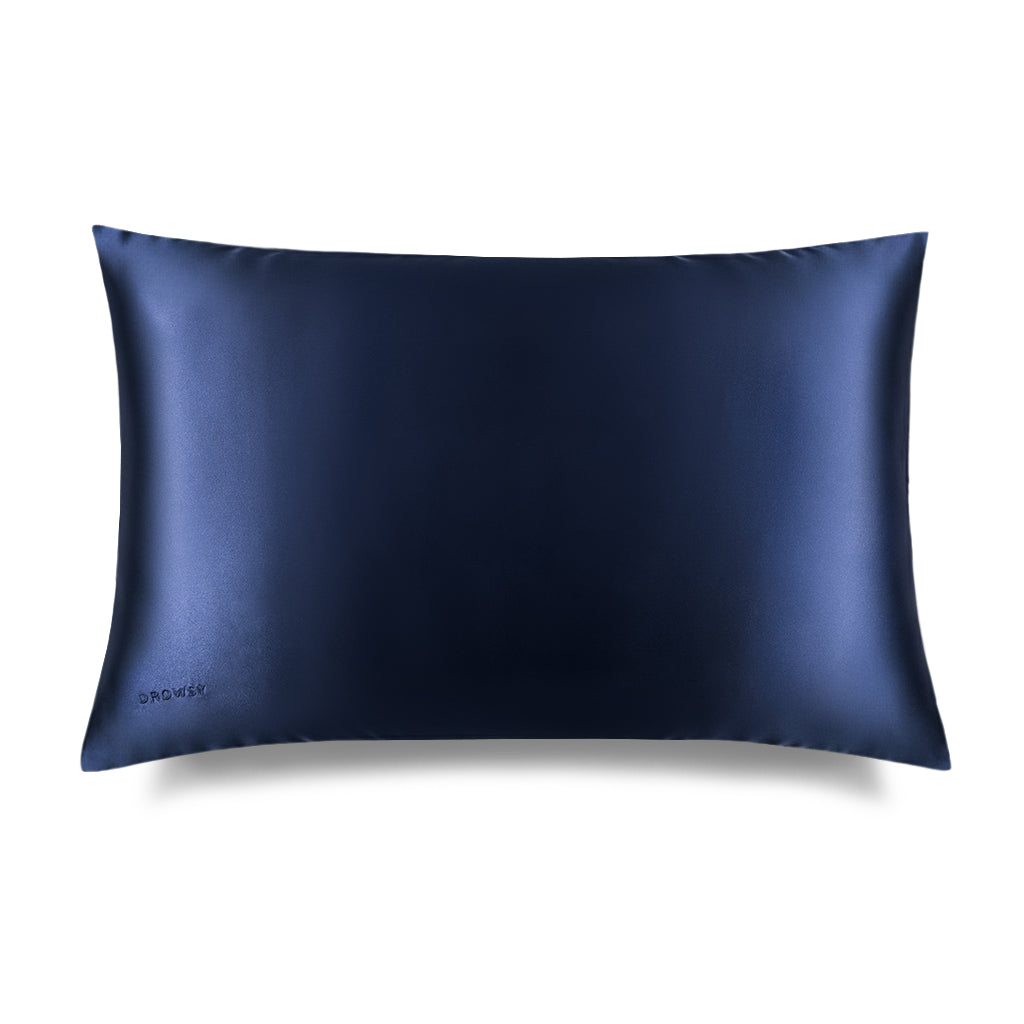 The drowsysleepco Midnight Blue Silk Pillowcase, shown on a white background, offers skincare and hair protection benefits with its smooth, rectangular design in dark navy blue silk.