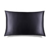 The Moonlight Shadow Silk Pillowcase by drowsysleepco is a rectangular black case with a smooth, shiny finish and minimal design. The brand name appears subtly in one corner. Photographed against a white background, it’s a skincare essential.
