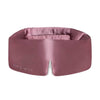 The Damask Rose eye mask by drowsysleepco is mauve mulberry silk, features DROWSY embossed on the left and a small notch at the bottom center. Soft, padded, and crafted for comfort.