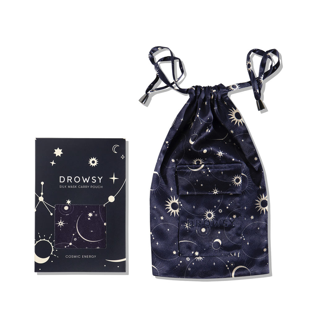 The drowsysleepco Cosmic Energy Silk Carry Pouch is a dark blue mulberry silk pouch and box set with celestial star and moon designs, silver accents, and is perfect for your Drowsy sleep mask. Box reads: Drowsy Silk Mask Carry Pouch – Cosmic Energy.
