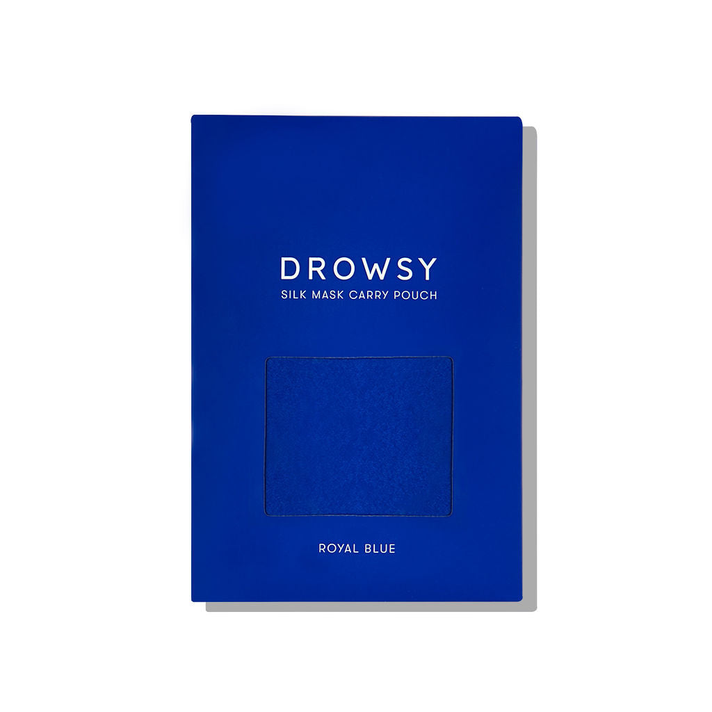 A rectangular royal blue package labeled drowsysleepco Royal Blue Silk Carry Pouch features a square window revealing the mulberry silk pouch inside. “Royal Blue” is printed at the bottom, perfect for storing your silk sleep mask.