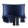 The Midnight Ritual Bundle Midnight Blue by drowsysleepco includes a silk sleep mask, pillowcase, SOS spray, drawstring pouch, and product box—all elegantly displayed against a white background for a luxurious touch.