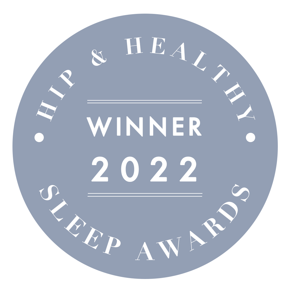 A circular blue badge with white text that reads HIP & HEALTHY WINNER 2022 SLEEP AWARDS.