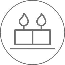Simple line drawing of two lit candles side by side, each with a flame, enclosed in a circular border.